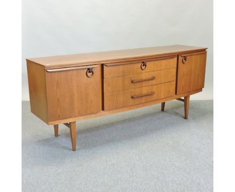 A 1970's teak sideboard, 184cm, together with a nest of three tile top tables