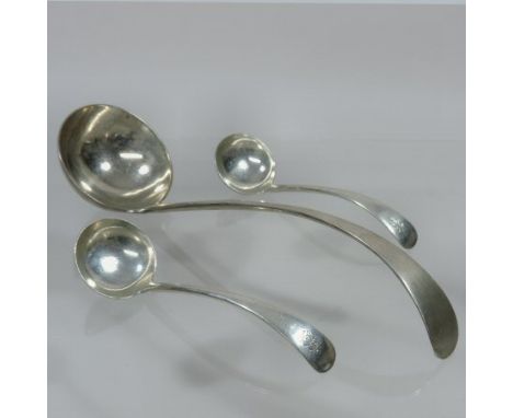 An Edwardian silver Old English pattern soup ladle, 31cm long, together with a pair of matching sauce ladles, each engraved w