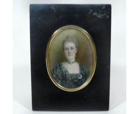 English School, 19th century, a half-length miniature portrait of a lady, wearing a black dress, oil on ivory, 11 x 8cm oval,