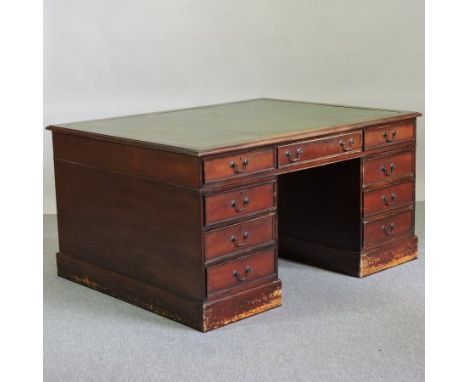 A reproduction mahogany partner's pedestal desk, with a green leather inset top, 149cm