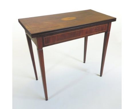A George III mahogany and inlaid folding card table, of rectangular shape, decorated with a patarea, with a green baize inter