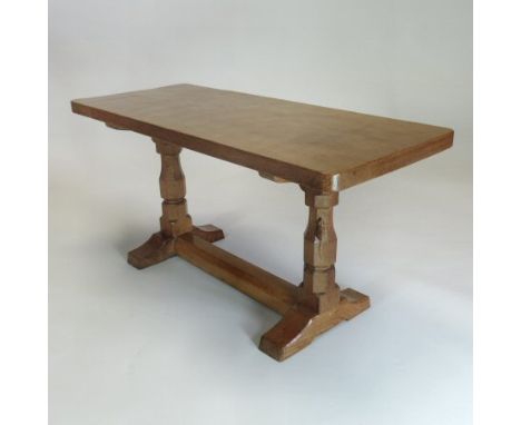 A Robert 'Mouseman' Thompson of Kilburn light oak coffee table, with an adzed rectangular top, on a trestle base, 90cm