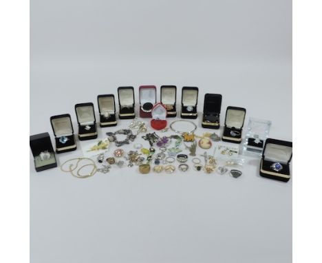 A collection of gem set rings boxed, together with a charm bracelet, necklaces and a silver bangle