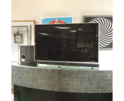 A Samsung LED 46 inch 3D smart television, with sound bar and speaker