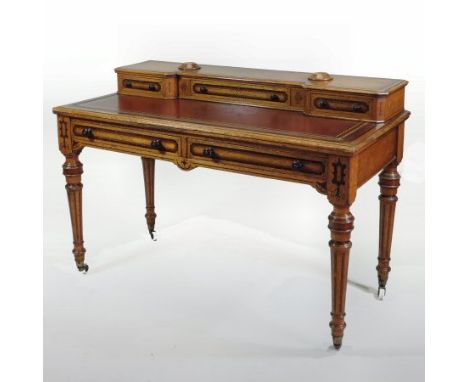 A Victorian walnut and inlaid writing desk, with a red leather top, on turned legs, 121cm