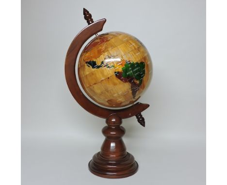 A reproduction globe, on a wooden stand, 72cm tall