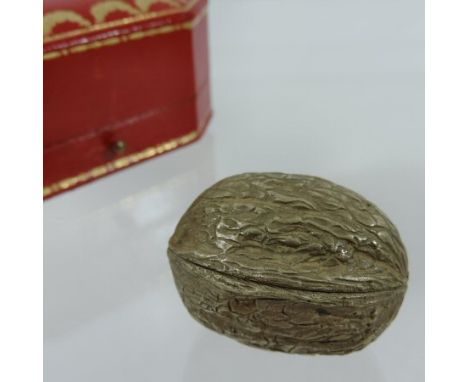 A Cartier 9 carat gold novelty snuff box, of hinged shape, in the form of a walnut, makers mark J.C., 4cm across, in a fitted