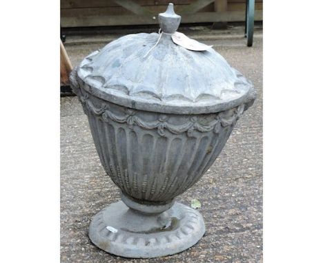 A 19th century lead urn and cover, of fluted pedestal shape, 46cm tall