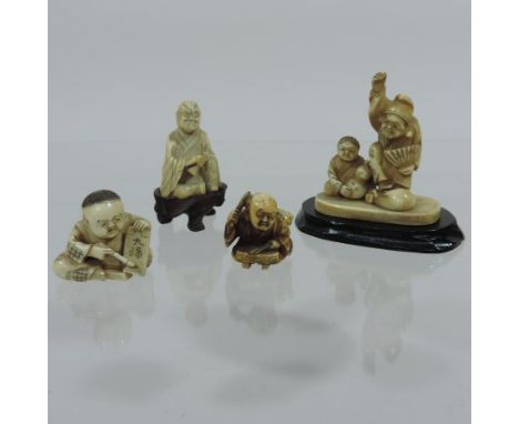 An early 20th century Japanese carved ivory netsuke, modelled as a seated child writing calligraphy, signed to base, 3.5cm ta