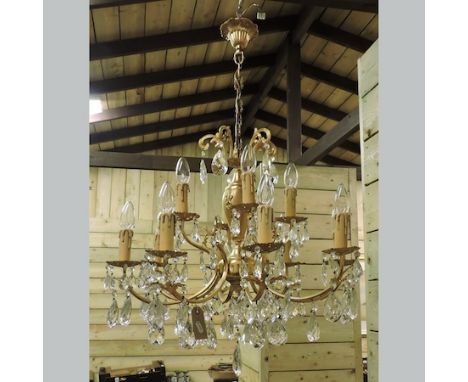 A gilt metal and glass eight branch chandelier, 60cm tall
