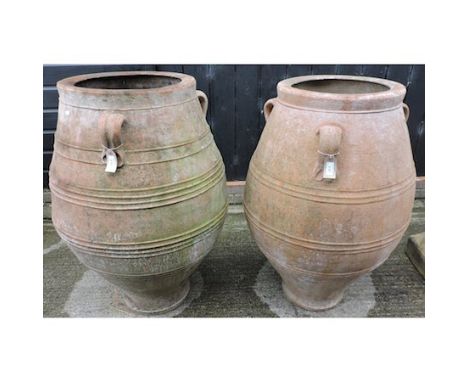 A large terracotta garden pot, together with another similar, largest 100cm tall