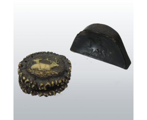 An early 19th century pressed horn snuff box, in the form of Napoleon's hat, inscribed Napoleon A. Wagram, 7cm across, togeth