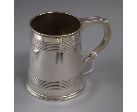 A George V silver mug with reeded bands, by Elkington &amp; Co, Birmingham, 1913, 11.2cm, 11 oz.