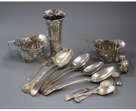 A small collection of Georgian and later silver flatware and sundry silver items, including an Edwardian embossed cream jug a