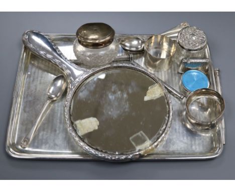 A silver dressing table tray, a silver and enamel pill box, a set of six silver coffee spoons, silver vesta case, two silver 