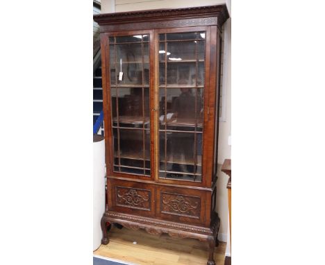 A 1920s Chippendale revival mahogany bookcase W.112cm