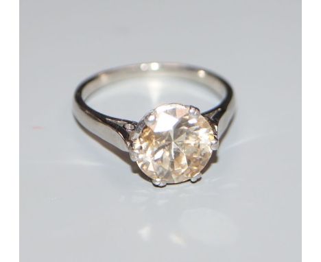 A white metal and solitaire diamond ring, the stone weighing 2.55cts, with an approximate colour and clarity estimated as L/M