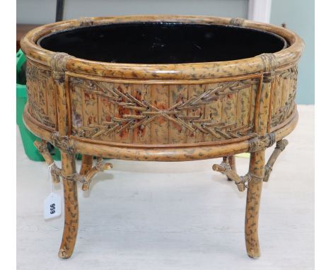 An oval bamboo planter W.56cm