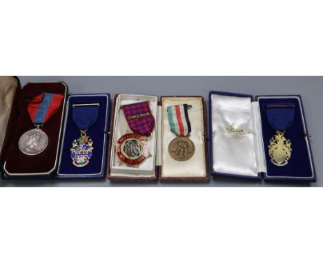 Three silver gilt and enamel medals and an ISM