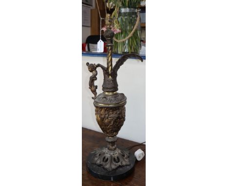 A large Renaissance-style brass table lamp