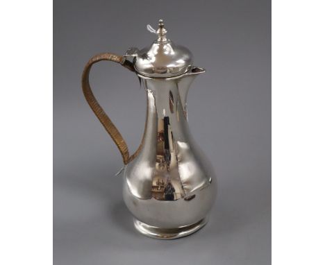 An Edwardian silver hot water jug, Charles Edwards, London, 1909, 21.5cm, gross 10.5 oz.