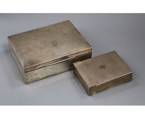 Two 1930's silver cigarette boxes including engine turned, largest 17.8cm.