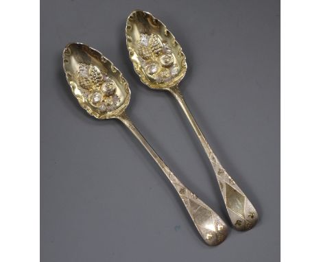 A pair of George III Old English pattern parcel silver gilt 'berry' serving spoons, London, 1806, no maker's mark, 22.5cm, 4.