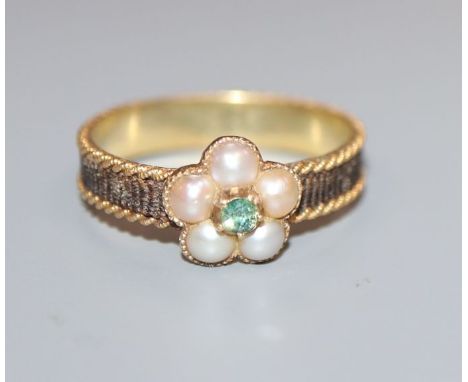 A 19th century yellow metal, plaited hair, split pearl and gem set mourning ring, size N.