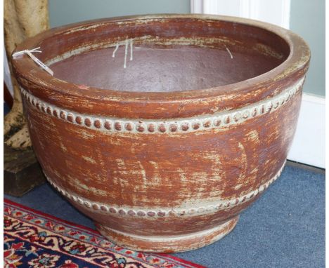 A brown glazed earthenware planter Diameter 62cm