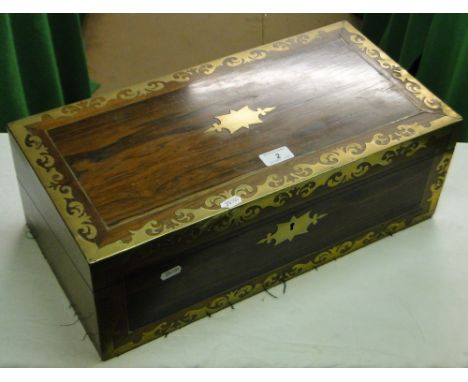 A brass bound writing slope with fitted interior and inkwell.