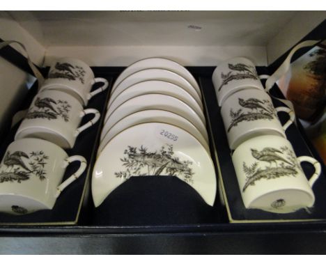 A Royal Worcester coffee set with bird decoration in presentation box.