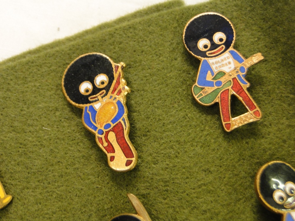 12 Enamelled Robertson's Golly badges.