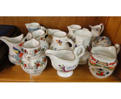 A boxed set of Royal Worcester jugs.