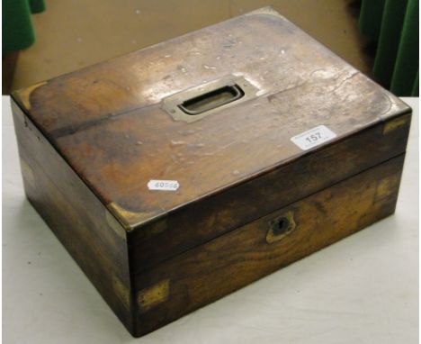 A brass bound walnut box containing playing cards.