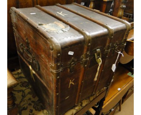 A Victorian leather and brass bound travelling trunk.