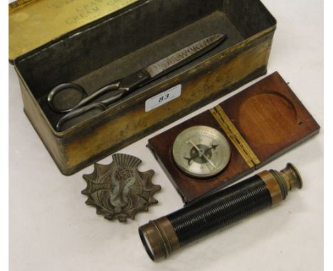 A cased compass, Woolworth's scissors, a small Stanley telescope, etc.