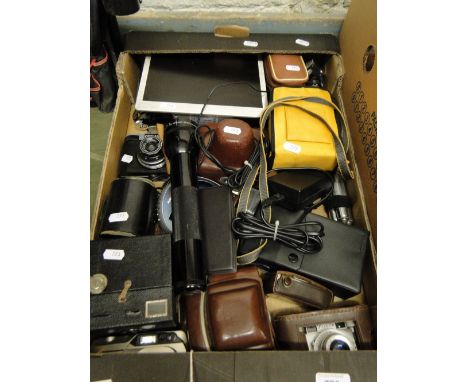 Various camera equipment including Canon underwater camera, light meters, etc.