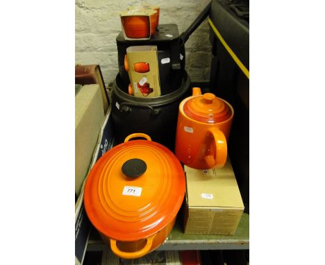 Le Creuset teapot, tureen, etc., and a cast-iron pan.