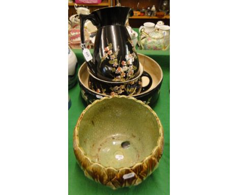 A jardiniere, a Bretby wash jug and basin set with chamber pot with painted floral decoration.