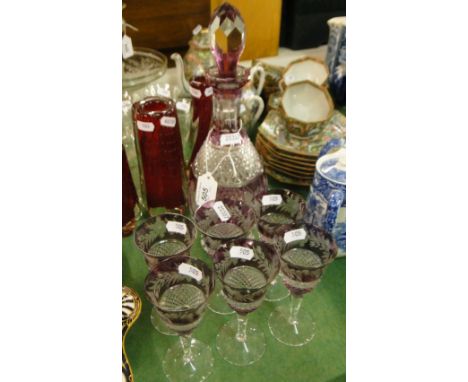 A crystal decanter and 6 matching glasses.