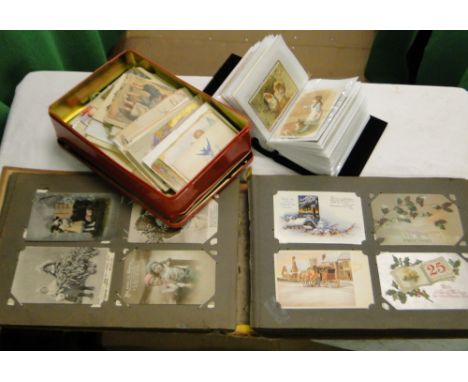 An old French postcard album with over 330 Vintage Christmas postcards together with an album of Victorian and later Christma