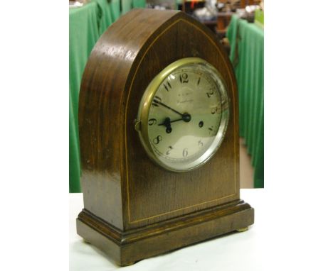 A lancet top mahogany mantel clock with 2-train movement by W E Hunt, Cambridge.