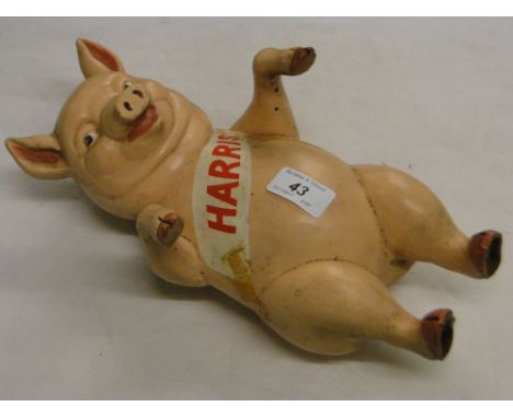 A Vintage composition pig for advertising Harris (sausages).