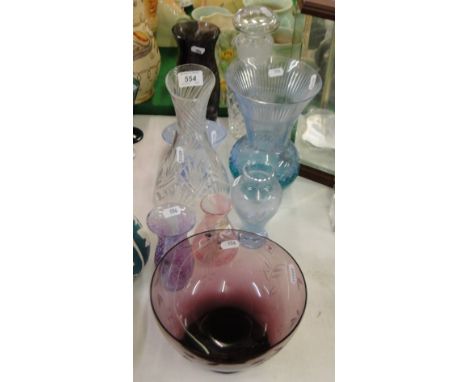 Various coloured glass vases and a jug decanter.