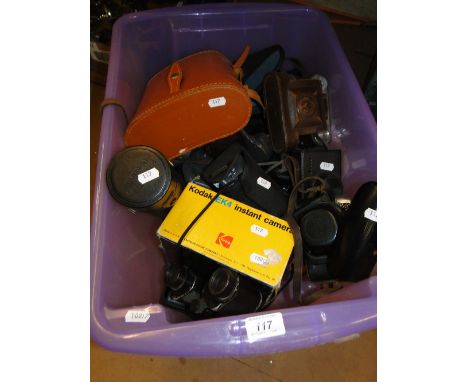A boxful of camera equipment and binoculars.