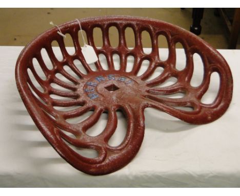A cast-iron Hornsby tractor seat.