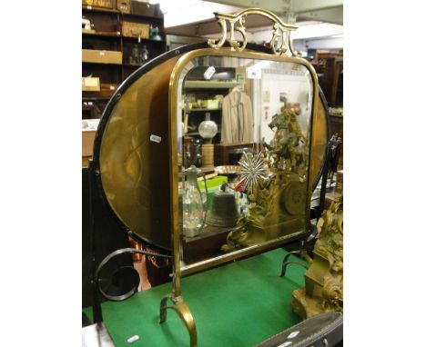 A brass framed firescreen with bevelled mirror and a wrought-iron firescreen with brass panel.