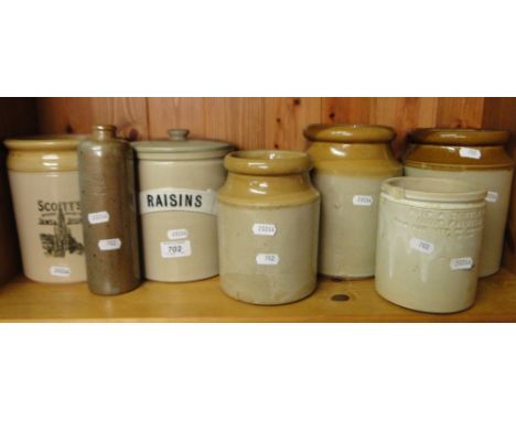 Shelf of Stoneware jars including Raisins.