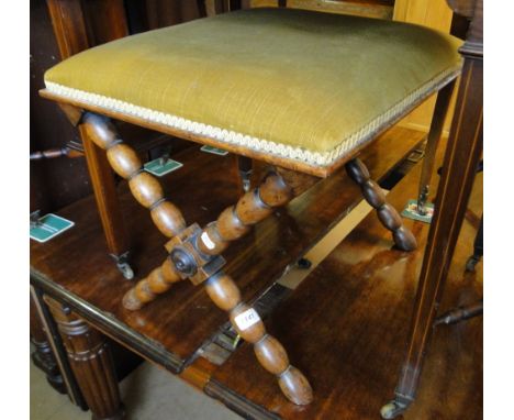 A Victorian upholstered stool on bobbin turned base.