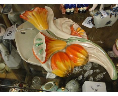 A Clarice Cliff relief moulded floral design wall pocket,height 25cm.